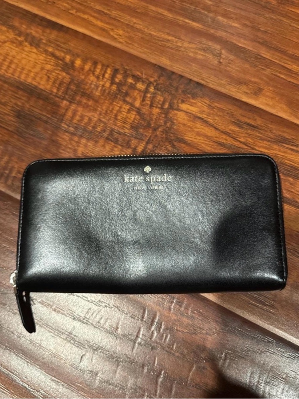 kate spade black leather zip-around wallet with gold logo